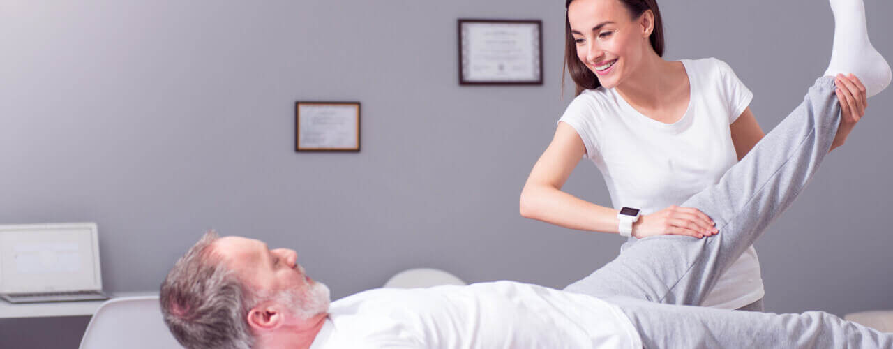 Old man doing physiotherapy for natural pain relief